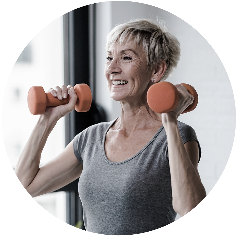 Older healthy woman lifting weights